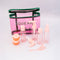 pink and green plastic 'squeaky clean' travel kit with two pots, a funnel, mini spatula, one pump, one spray bottle and label sheet with the items outside the pouch