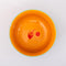 top view of green small ceramic serving bowl with orange interior and red strawberry stamp inside and light blue trim
