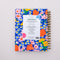 back view of cobalt blue medium 17-month planner with colorful floral print and pink elastic closure