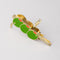 top view of gold pocket corkscrew with three green olives