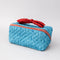 blue quilted zipper makeup bag with red bow handle and all blue floral and bow print
