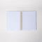interior lined pages of cream mini notebook with colorful striped border and teal 'let me write that down before i forget it'