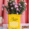 yellow pasta box ceramic vase with flowers inside