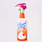 red whipped cream canister shaped vase with flowers inside