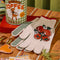 cream gardening gloves with tomato bunches and red trim