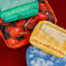 4 packing cubes with various sayings and realistic prints