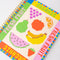 side view of colorful fruit tile mini notebook