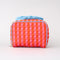 back view of pink and red vertical stripe toiletry bag with light blue bow handle