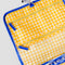 up close of yellow gingham of blue and white Scandinavian plaid with red bow handle