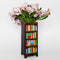 side view of brown bookshelf vase with colorful book shelves with flowers inside