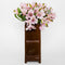 back view of brown bookshelf vase with colorful book shelves