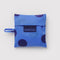 blue baby baggu with dark blue polka dots in a matching pouch