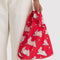 model holding red baby baggu with all over bunny print
