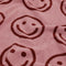 up close of pink and maroon reversible smiley towel