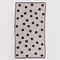cream with black polka dots