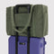 soft olive green cloud carry on on a suitcase