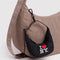 black crescent bag charm with 'I LOVE NY'  on a bag