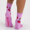 back view of model wearing pink socks with all over cherry print