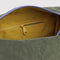 interior zipper of caper green dopp kit with plum handle and periwinkle zipper trim