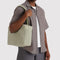 model carrying celadon (sage) everyday cloud bag