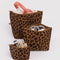 set of three leopard print go pouch set  with items inside