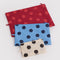 flattened set of 3 polka dot go pouch set: cream with black dots, blue with dark blue dots and red with bright red dots