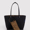 black reversed side of tote with leopard removable pouch