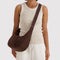 model carrying coffee medium crescent bag