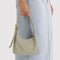 model holding celadon (sage) mini nylon shoulder bag