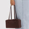 model holding coffee nylon bowler bag