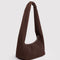 side view of dark brown meringue bag with thick twist strap