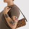 model carrying leopard print pochette