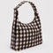 side view of brown blurred gingham nylon shoulder bag