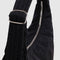 silver buckle on black nylon bag with silver studs on the side