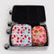 set of two packing cubes: small strawberries, large cherries in a suitcase