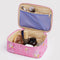pale yellow interior of bright pink small cosmetic bag with melting gold star print