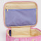 up close of bright pink small cosmetic bag with melting gold star print