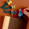 model pulling out four colorful butterfly 3D popup bookmarks out of pages of a book