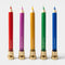 colorful pencil taper candle set of 5 in: purple, blue, green, yellow and red on brass stands