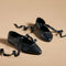 black ballet inspired flats with tie laces and pointed toe