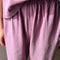 up close of model wearing dusty lilac cotton balloon pants and matching top