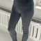 sideview of model wearing heather grey ribbed cashmere leggings