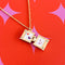 inside of gold ravioli locket necklace