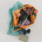 dopp kit with handle in marigold with all over orange tree pattern with items inside