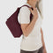 model carrying mahogany mini nylon shoulder bag with matching strap and trim