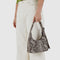 model carrying grey snakeskin square mini shoulder bag