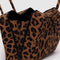 side view of brown leopard nylon bowler bag