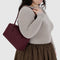 model carrying mahogany rectangular nylon bowler bag with matching zipper and charm clasp