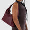 model carrying mahogany recycled leather shoulder bag with silver charm clasp