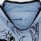 interior zipper of light blue small crescent bag with black embroidered ballet icon print and black strap